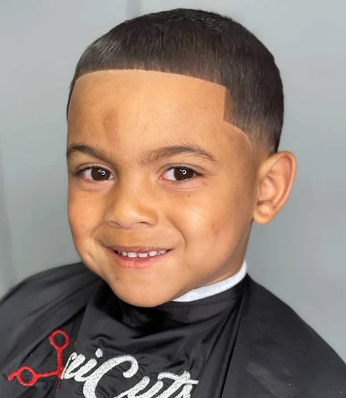 35 Popular Boy’s Haircuts Trending in 2025 (Cool & Stylish Ideas for All Ages) 23 This image has an empty alt attribute; its file name is Kids-Buzz-Cut.webp